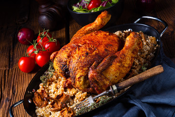 Grilled spicy chicken with barley groats and mushrooms