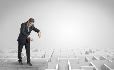 Fototapeta premium Zombi elegant businessman on the top of a labyrinth 