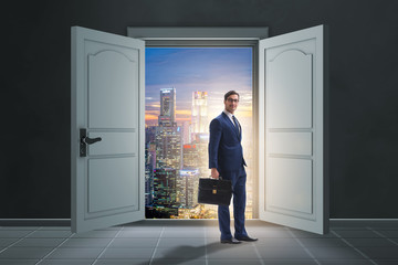 Fototapeta premium Businessman entering big large door