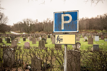 Parking sign at a graveyard warning for thieves.
