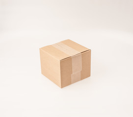 A brown, small, cardboard box on white background.