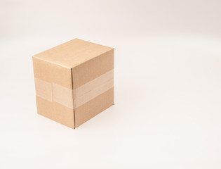 A brown, small, cardboard box on white background.