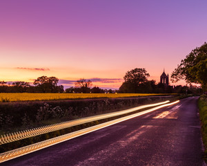 Rapeseed field at sunset with light trails