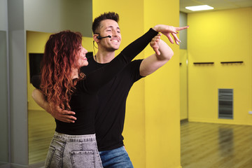 Dance instructors of salsa and bachata at their class