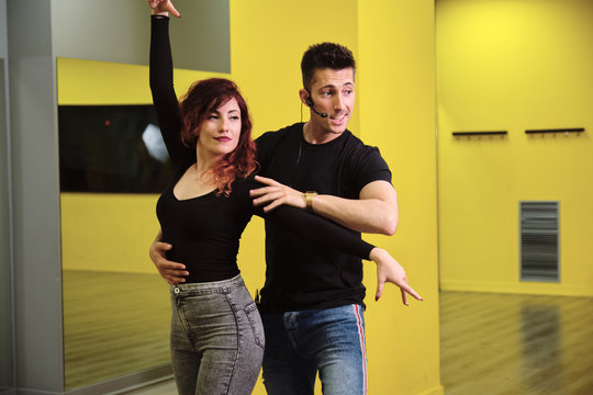 Dance instructors of salsa and bachata at their class