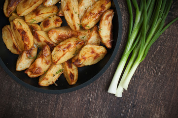 Roasted potato in pan. Horizontal view from above