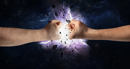 Obraz na płótnie Canvas Two hands fighting with storm explosion concept 
