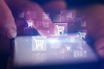 Finger touching phone with online shopping concept and dark background
