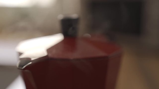 preparing a cup of coffee with an Italian coffee maker