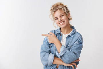 Charming friendly pleasant smiling european blond curly haired young girl tilt head tender grinning...