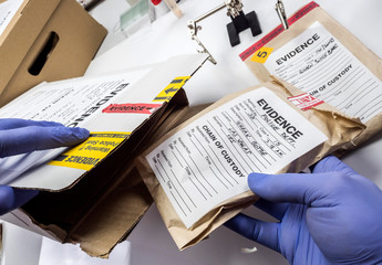 Police expert saved in a box records and evidence of a case of murder in the laboratory scientist