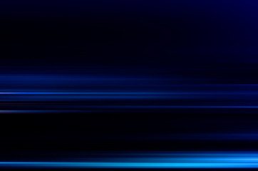 digitally generated image of blue light and stripes moving fast over black background