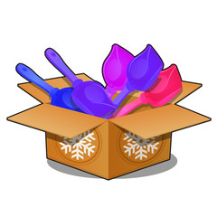 Cardboard box with colored plastic shovels for snow isolated on white background. Sample of poster, party holiday invitation, festive card. Vector cartoon close-up illustration.