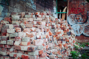 old bricks stacked along the wall
