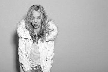 Fototapeta premium young beautiful girl in a white jacket
