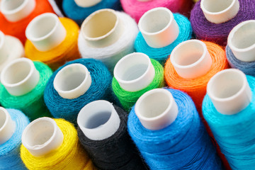Colorful spools of sewing thread. Colored thread for sewing