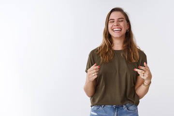 Happiness, delight, wellbeing concept. Attractive carefree charming positive woman having fun...