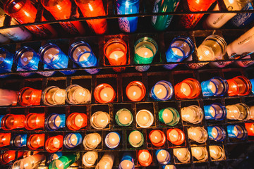 Many colorful candles in the Benedictine abbey Santa Maria de Montserrat 