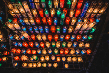 Many colorful candles in the Benedictine abbey Santa Maria de Montserrat 