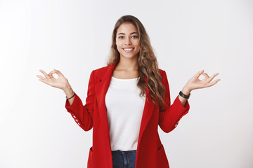 Happy calm stress-free modern 25s businesswoman control feelings hands sideways showing mudra zen...