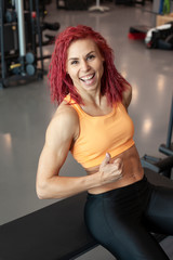 Fototapeta na wymiar athletic girl in a fitness gym