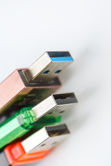 Fototapeta premium Detailed view of a black USB flash drive with a silver-blue connector. Photo on a white background