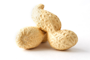 Peanuts. Two peeled nuts isolated on white background. Peanut macro.
