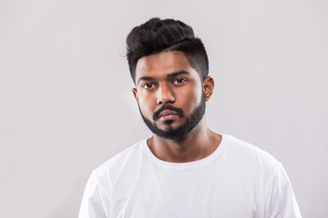 close up portrait of happy young indian man isolated on white background