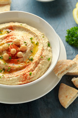 Hummus with olive oil, paprika, lemon and pita bread