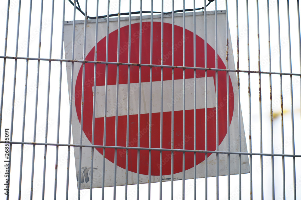 Canvas Prints Red and White British No Entry Road Sign with Steel Fence, Red Stop Road Sign, Traffic Sign Prohibiting, Fence Grilles Rust Texture Background, Warning Sign at Fence Wall, Prohibition Sign