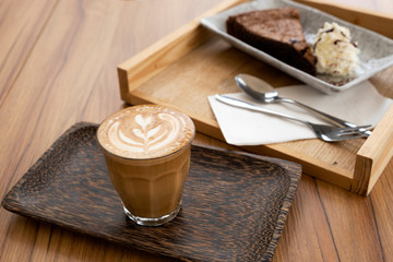 Hot latte on a wooden table