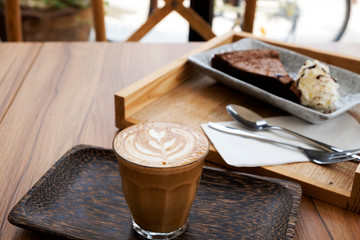 Hot latte on a wooden table