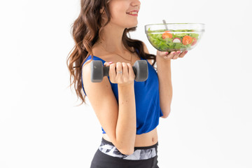 Healthy lifestyle, people and sport concept - Close up of a healthy woman with vegetables and...