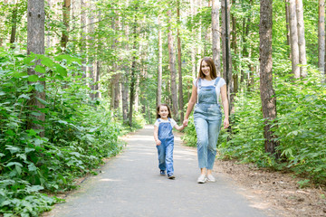 Family and nature concept - Mother and daughter spend time together outdoor