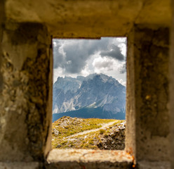 Window overlooking the high mountain landscape of the Italian Dolomites Trentino Alto Adige