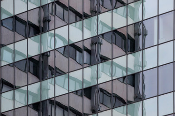 Fototapeta na wymiar Building is reflected in a glazed modern building office center. Europe, Bulgaria, Sofia
