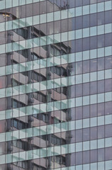 Building is reflected in a glazed modern building office center. Europe, Bulgaria, Sofia