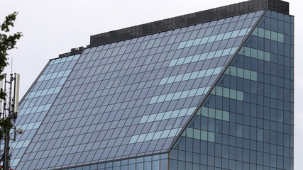 Fototapeta na wymiar Beautiful photos of modern buildings under blue sky. Sky reflecting in windows of office building