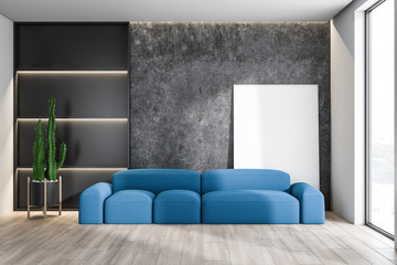 Concrete living room interior with sofa and poster