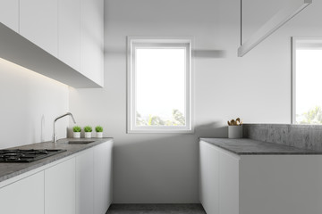 Fototapeta na wymiar Loft white kitchen with countertops and island