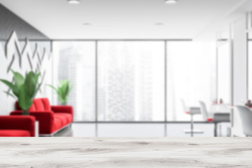 Blurred hairdressing salon interior with red sofas