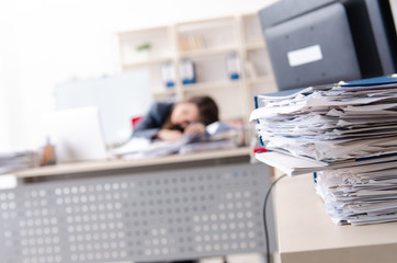 Beautiful female employee unhappy with excessive work 