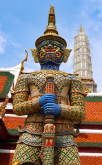 Wat Phra Kaew or Temple of Emerald Buddha, Guardian statues and Grand palace located within the grounds of the Grand Palace in Bangkok is Thailand’s most sacred temple and pilgrimage site for Thai