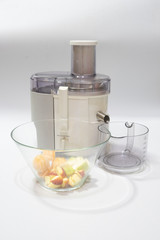 Modern electric juicer  various fruit and glass of freshly made juice  healthy lifestyle concept