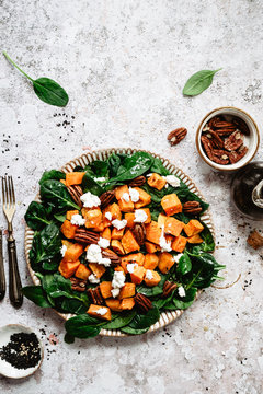 Healthy salad with pecans and sweet potatoes 