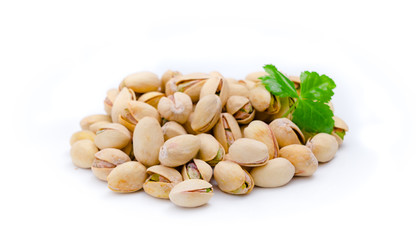Pistachio nuts with leaves.Pistachios on a white background .