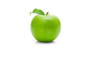 Ripe green apple with leaf on a white background .