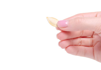 Pumpkin seeds in hand healthy on a white background isolation