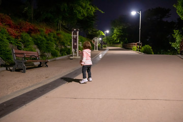 child walks in the park at night