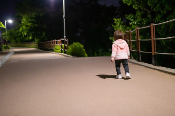 child walks in the park at night